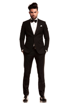 Guy wearing a black tuxedo suit