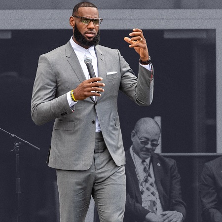 Lebron James wearing a gray slim fit suit