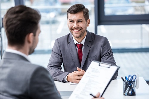 man wearing gray suit for interview