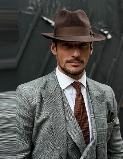 man wearing a brown mens dress hat with a suit