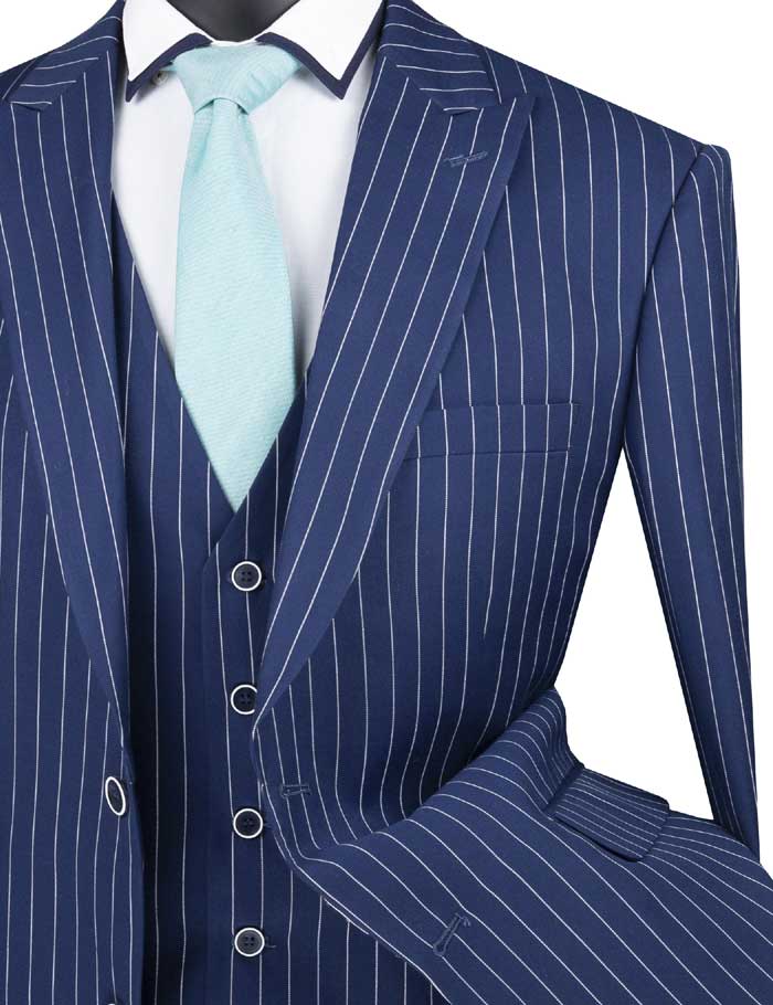 Close up of a navy blue pinstripe suit jacket and vest with light colored tie.